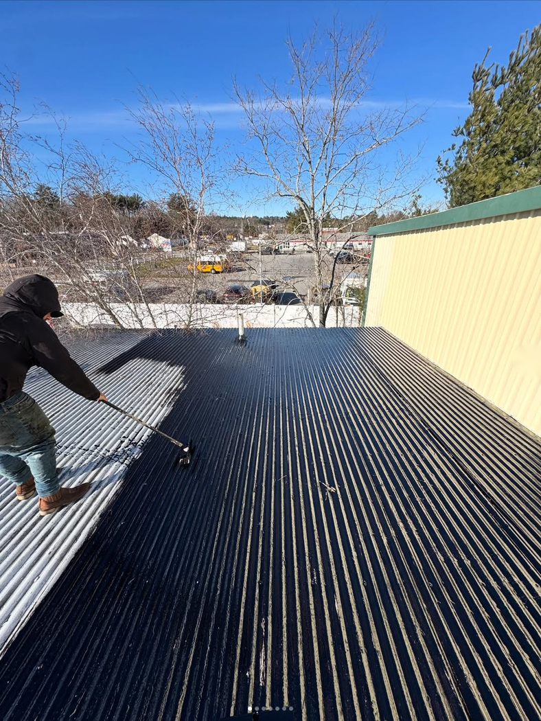 Metal commercial roof panel installation in progress