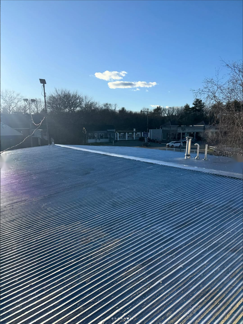 Completed roofing detail on a Massachusetts property